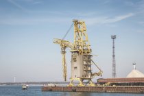 Germany, Warnemuende, Baltic Sea, Harbour Rostock Port, crane over water — Stock Photo