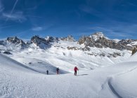 Italy, Rhemes-Notre-Dame, Benevolo, people ski mountaineering in winter alps — Stock Photo