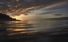 Spain, Canary Islands, Fuerteventura, Morro Jable, water surface at sunset — Stock Photo