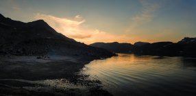 View of hills and lake water at night — Stock Photo