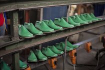 Shoe lasts on shelf in cobbler's workshop — Stock Photo
