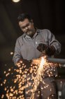 Metal worker welding in factory workshop — Stock Photo