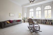 Spacious living room with rocking chair — Stock Photo