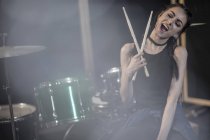 Female rock drummer at recording studio — Stock Photo