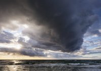 Germany, Mecklenburg-Western Pomerania, rain clouds over Baltic Sea — Stock Photo