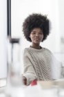 Smiling african american woman in office — Stock Photo