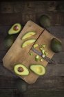 Whole and sliced avocado — Stock Photo