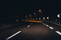 Italy, Udine, driving at night along the highway — Stock Photo