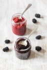 Raspberry and blackberry jam jars with chia seeds — Stock Photo