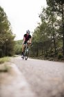 Cyclist riding racing cycle — Stock Photo