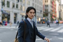 USA, New York City, businessman commuting in Manhattan — Stock Photo