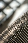 Closeup view of typebar with letters of typewriter — Stock Photo