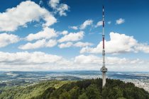 Switzerland, Zurich, Scenic view from Uetliberg with communication tower and mountain range — Stock Photo