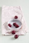 Sweet cherries with bowl — Stock Photo