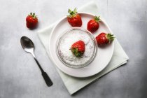 Vegan strawberry chia pudding with spoon on napkin — Stock Photo