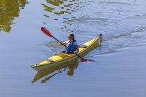 Germany, mature woman kayaking — Stock Photo