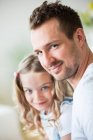 Father and daughter looking at camera, portrait — Stock Photo