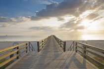 Germany, Boltenhagen, view to sea bridge under cloud — Stock Photo
