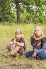 Germany, Saxony, Indians and cowboy party, Kids smoking pipe of peace — Stock Photo