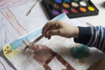 Little boy painting with watercolours, close-up — Stock Photo