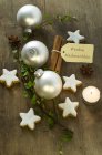 Christmas decoration with cinnamon stars and baubles — Stock Photo