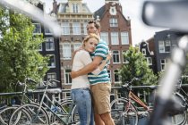 Netherlands, Amsterdam, couple embracing in the city — Stock Photo