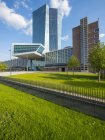 Germany, Frankfurt, European Central Bank, main entrance and green grass on foreground — Stock Photo
