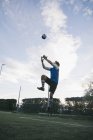 Goalkeeper trying to catch football — Stock Photo