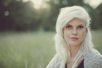 Portrait of a blonde girl in summer field — Stock Photo