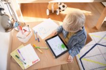 Little boy drawing with digital tablet — Stock Photo
