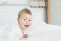 Excited baby girl portrait, looking aside — Stock Photo