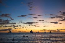 Philippines, Boracay, sunset with sailing boats — Stock Photo