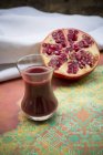 Glass of pomegranate juice — Stock Photo