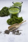 Two glasses of kale smoothie and chia seeds — Stock Photo
