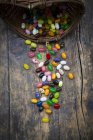 Colorful jelly beans on wooden surface — Stock Photo