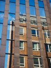 Germany, Hamburg, old building reflecting at facade on modern building — Stock Photo