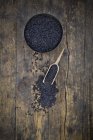 Black organic basmati rice in bowl, small shovel — Stock Photo