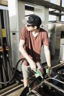 Teenager at gas station refuellng convertible car — Stock Photo
