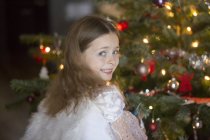 Portrait of little girl with angle wings at Christmas time — Stock Photo
