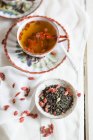 Cup of green jasmine tea with dried Goji berries, Lycium barbarum — Stock Photo