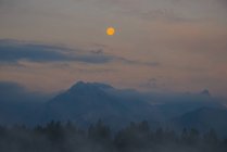 Germany, Bavaria, Fuessen, morning light at full moon at Hopfensee — Stock Photo