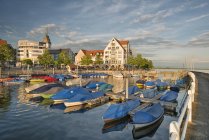 Germany, Baden-Wuerttemberg, Lake Constance, Friedrichshafen, covered boats at jetty — Stock Photo