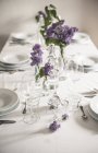 Festive laid table with lilac, Syringa — Stock Photo