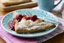 Home made cherry turnover on plate, close up — Stock Photo