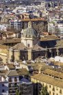 Spain, Andalusia, Granada, Aerial cityscape with domed building in sunlight — Stock Photo
