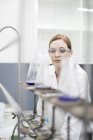 Female Scientist in lab working with liquids — Stock Photo