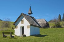 Germany, Baden-Wurttemberg, Freiburg, Schauinsland, Chapel at Rappeneck over grass — Stock Photo