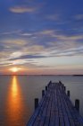 Austria,Burgenland, View of dock on Lake Neusiedl at sunrise — Stock Photo