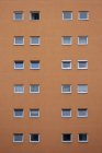 Orange house facade with squared windows — Stock Photo