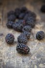 Fresh Blackberries on dark wooden table — Stock Photo